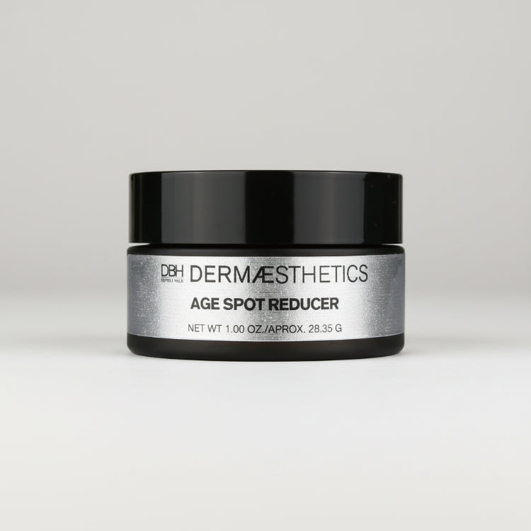 Dermaceutical jar labeled 'Age Spot Reducer' on a light gray background