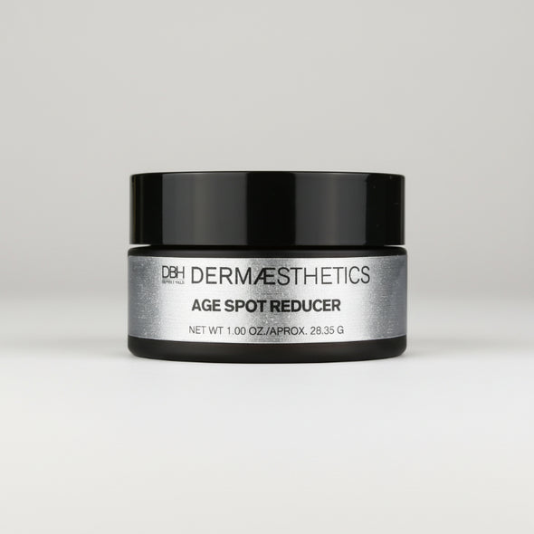 Dermaceutical jar labeled 'Age Spot Reducer' on a light gray background