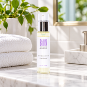 BiON Antibacterial Cleanser on a bathroom counter with towels