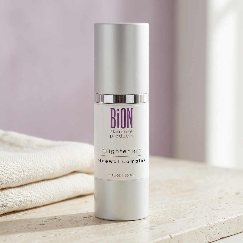 BiON Brightening Renewal Complex silver bottle on pale stone beside ivory linen