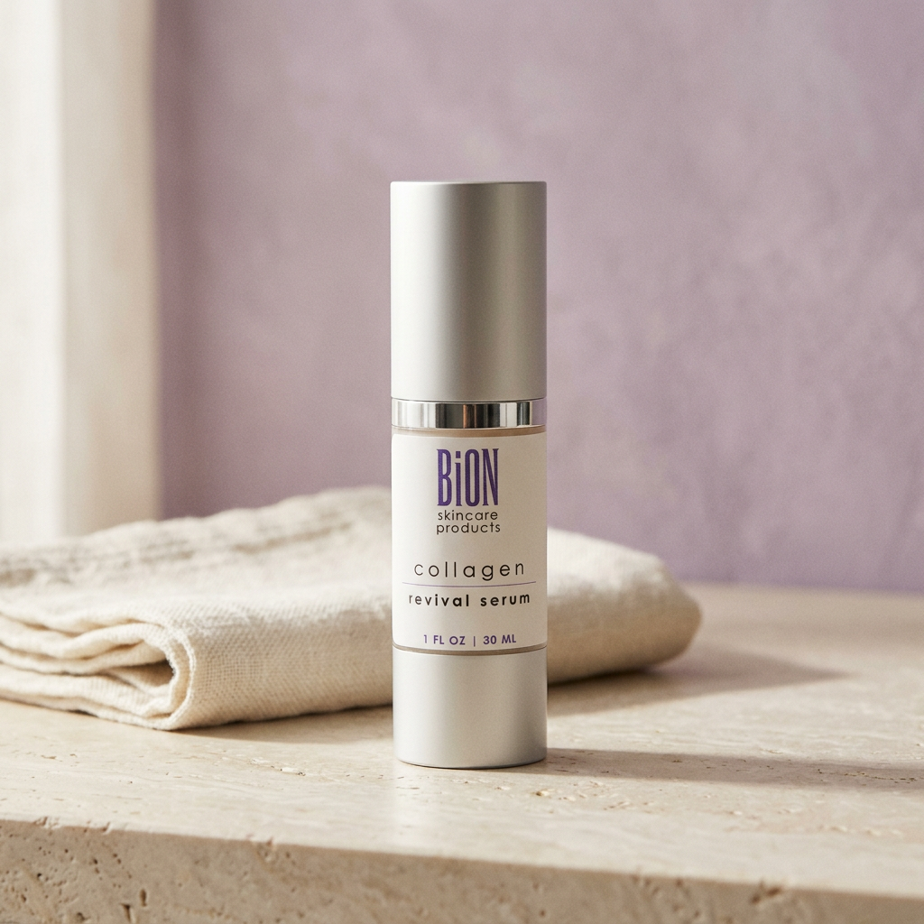 BiON Collagen Revival Serum on a pale stone vanity beside ivory linen with soft lilac background