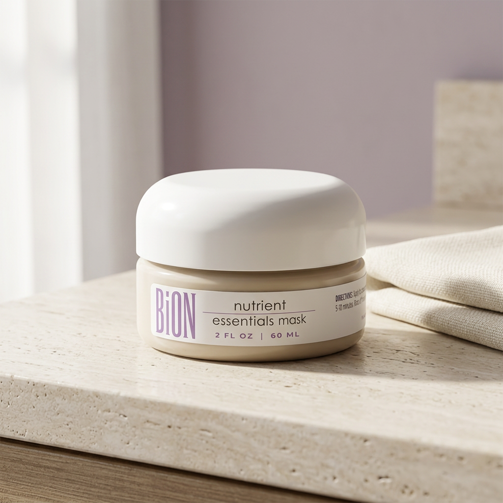 BiON Nutrient Essentials Mask jar on pale stone vanity beside folded ivory linen